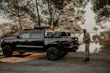 A sturdy pickup truck loaded with cargo accessories under bright daylight
