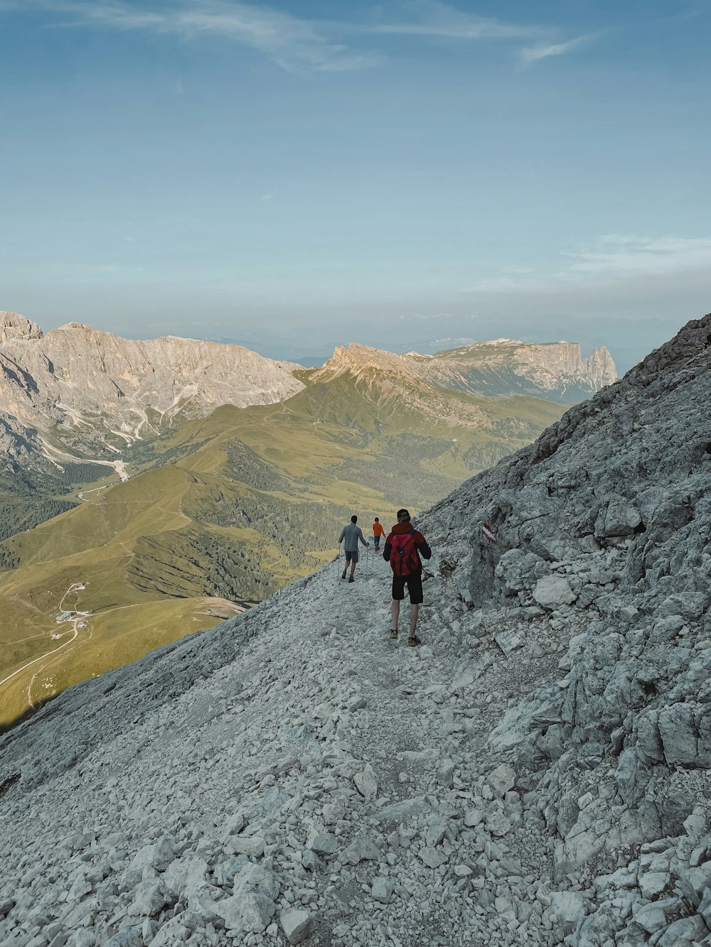 a group of people hiking up a mountain