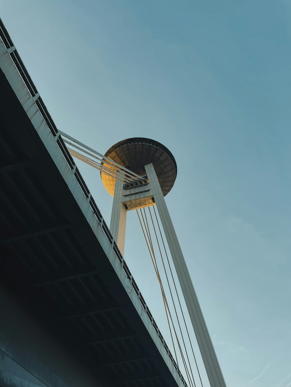 a view of a bridge with a water tower in the background