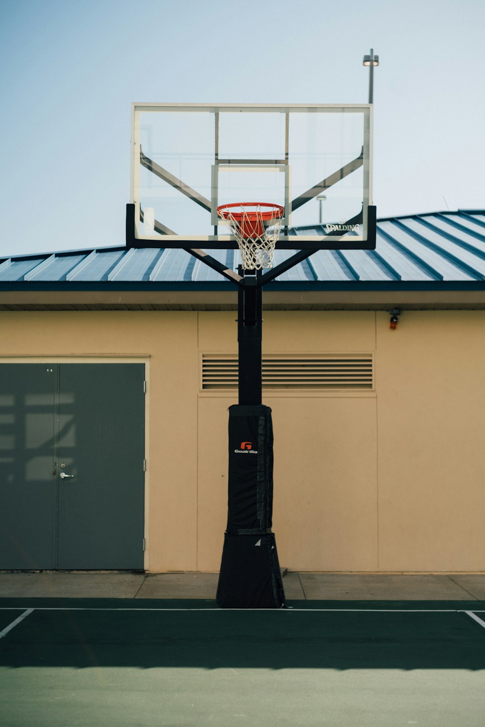 a basketball hoop in front of a building