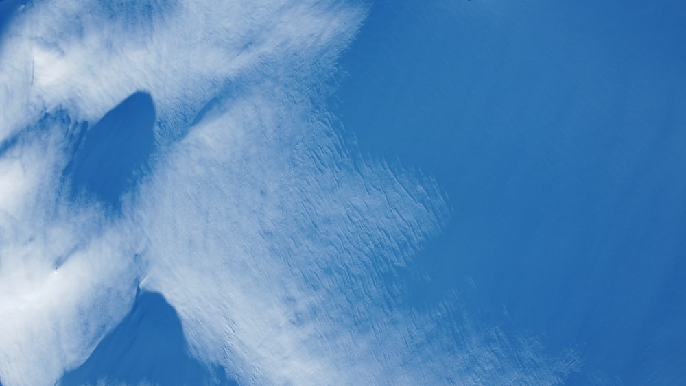 a person skiing down a snow covered slope