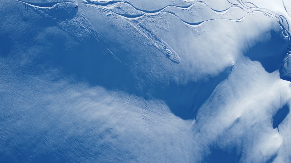 a snow covered mountain with a sky background