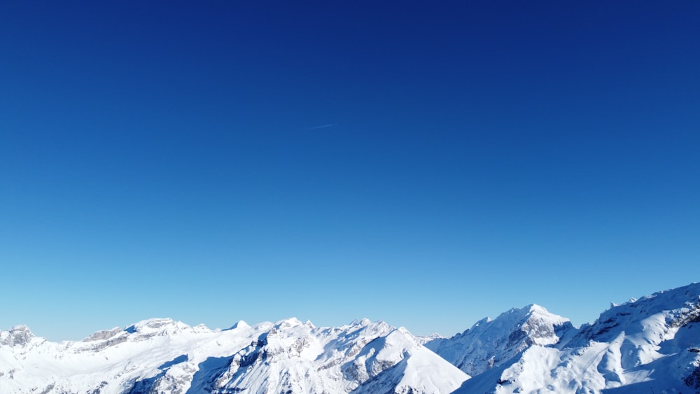 a person on a snowboard on a snowy mountain