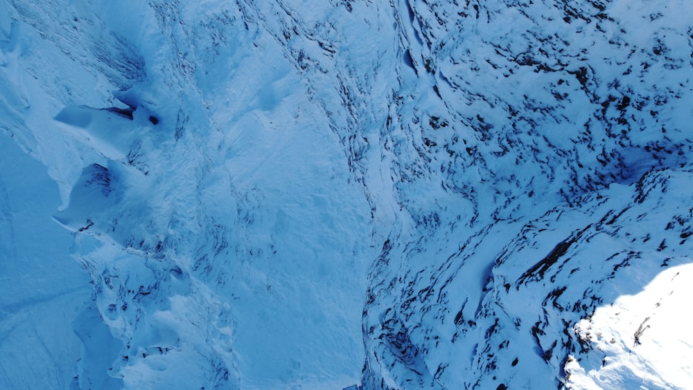 an aerial view of a snow covered mountain