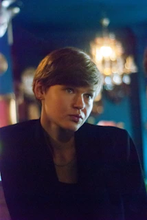 A serene beauty salon corner with soft lighting and elegant decor.