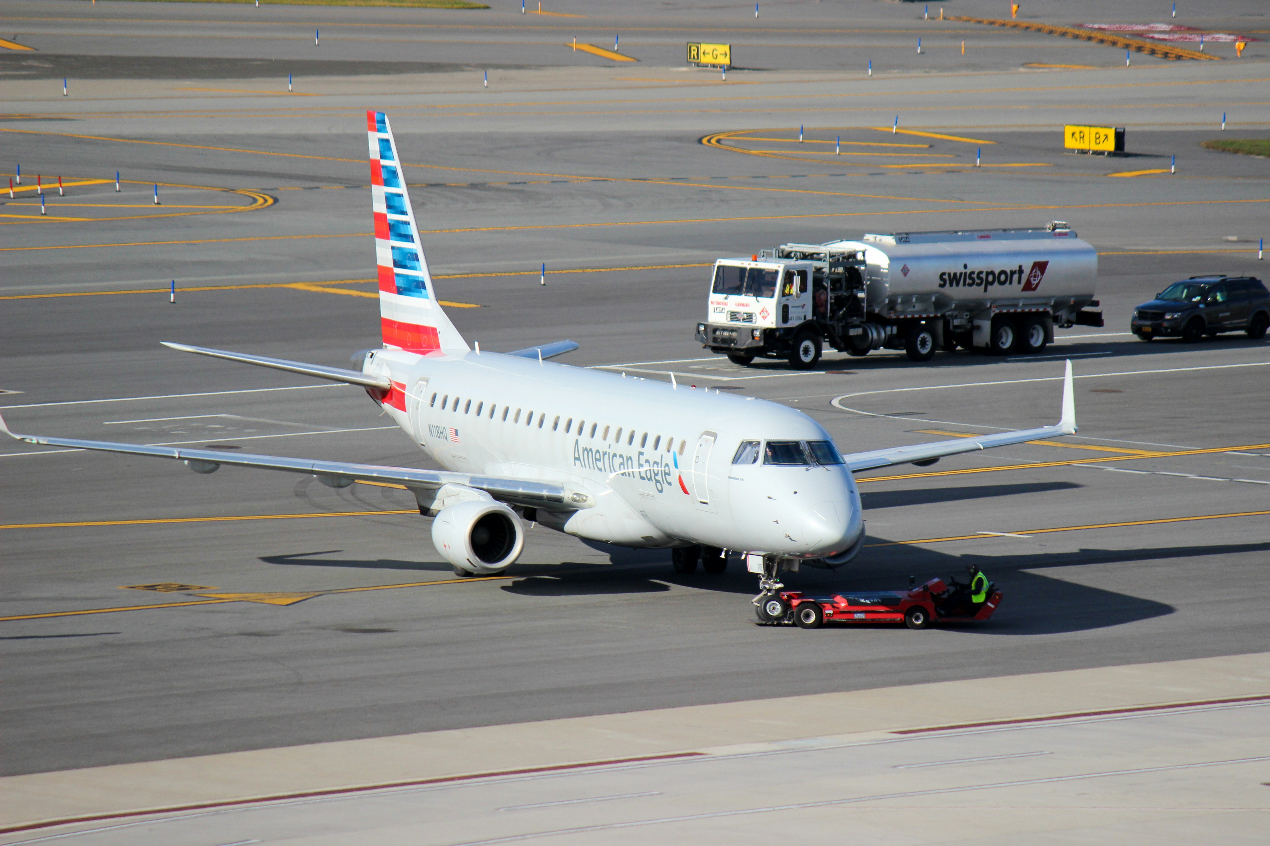 a large jetliner sitting on top of an airport tarmac