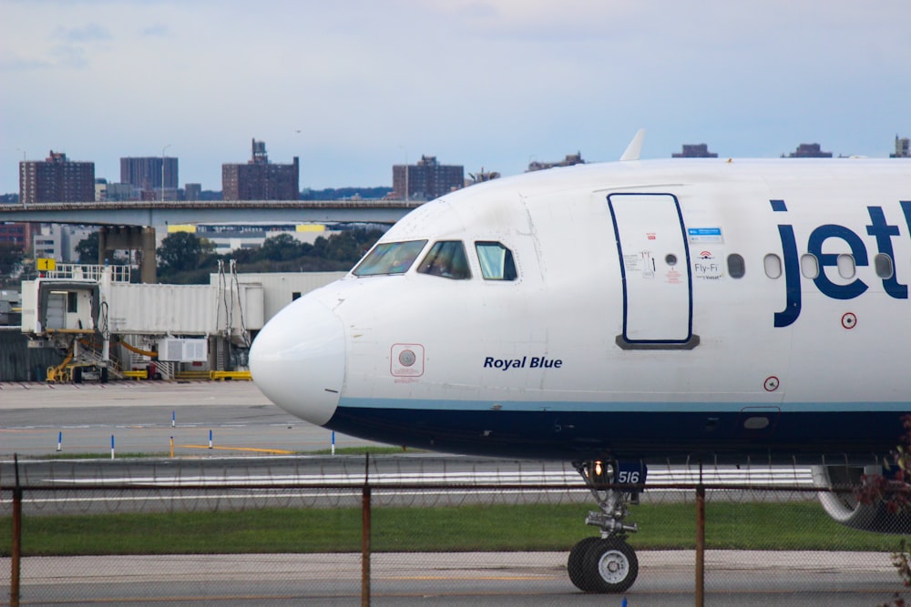 a large jetliner sitting on top of an airport tarmac