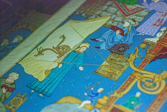 A vibrant, intricately detailed illustration featuring people in traditional attire, possibly from a historical or cultural context, accompanied by mythical creatures and ornate patterns.