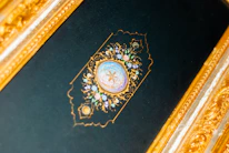 An elegant navy and cream-toned vignette showing a masonic symbol subtly framed by a family photo.