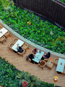 An elegant digital table booking system showing privacy pods and social tables in 3D.