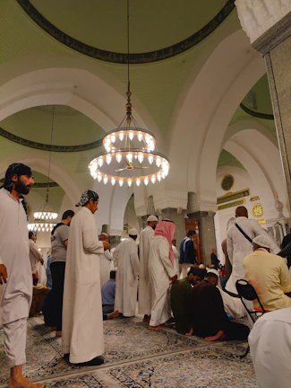 Members of a masonic order gathered in ceremonial regalia inside the hall.