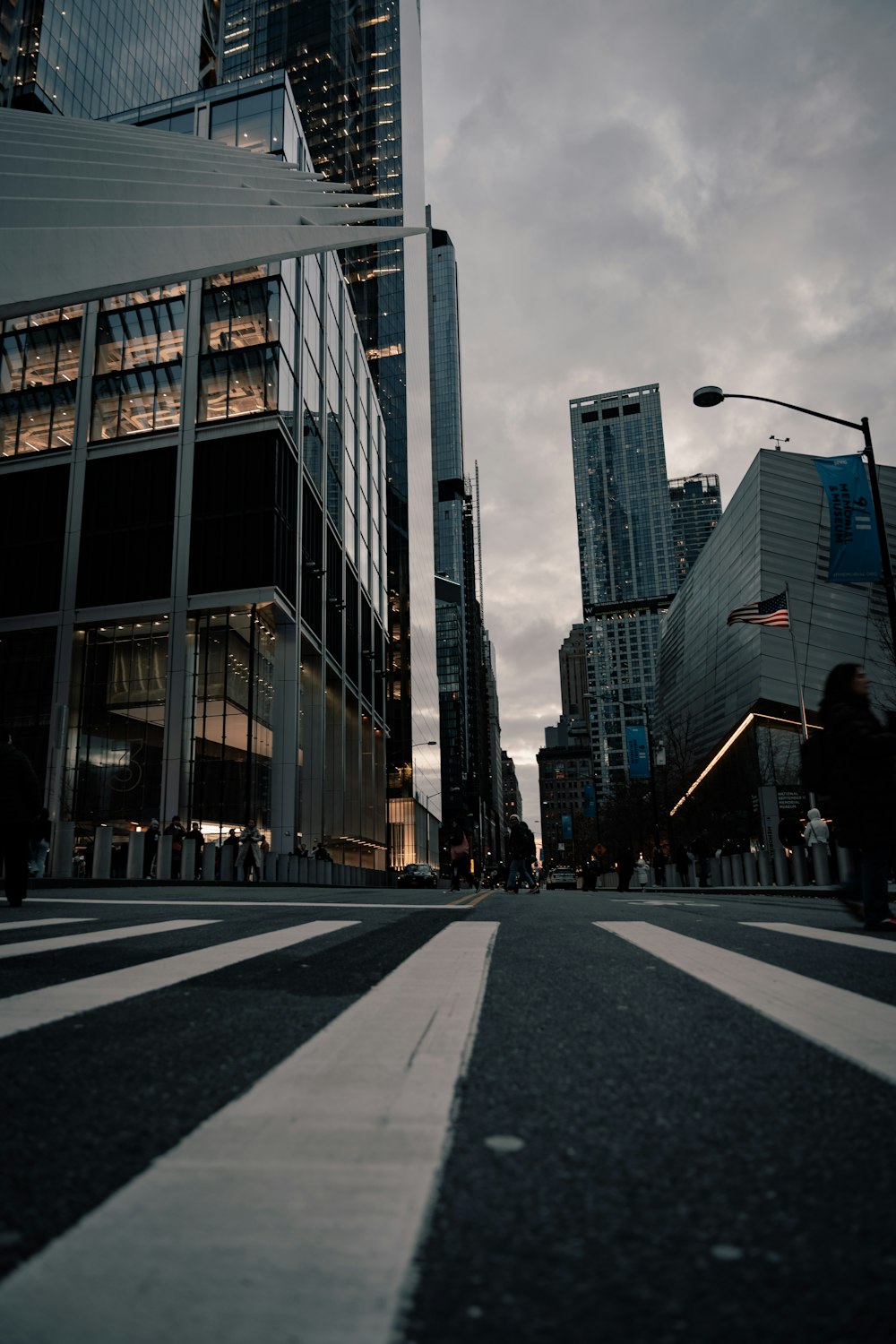 a city street with tall buildings in the background