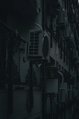 A sleek split air conditioner mounted on a modern wall with ambient lighting.