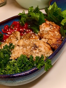 A vibrant, colorful plate of fresh salad and grilled chicken, showcasing the quality and freshness of King Food's offerings.