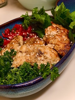 A beautifully arranged plate of grilled chicken and vegetables.