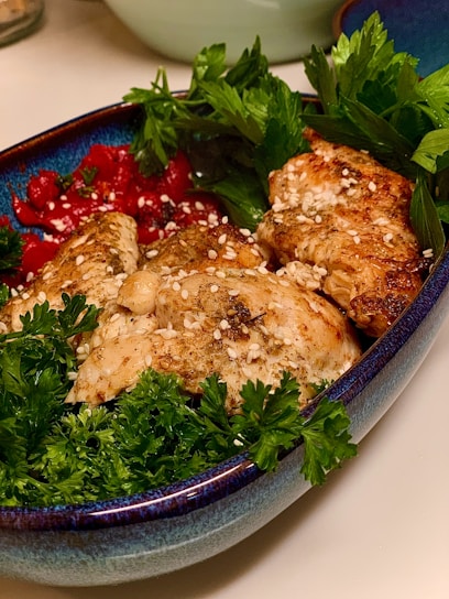 A vibrant, colorful plate of fresh salad and grilled chicken, showcasing the quality and freshness of King Food's offerings.