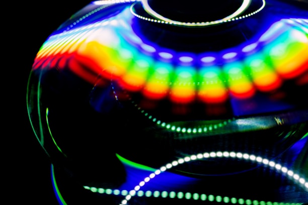 An abstract representation of a cosmic theme with swirling colors and light patterns.