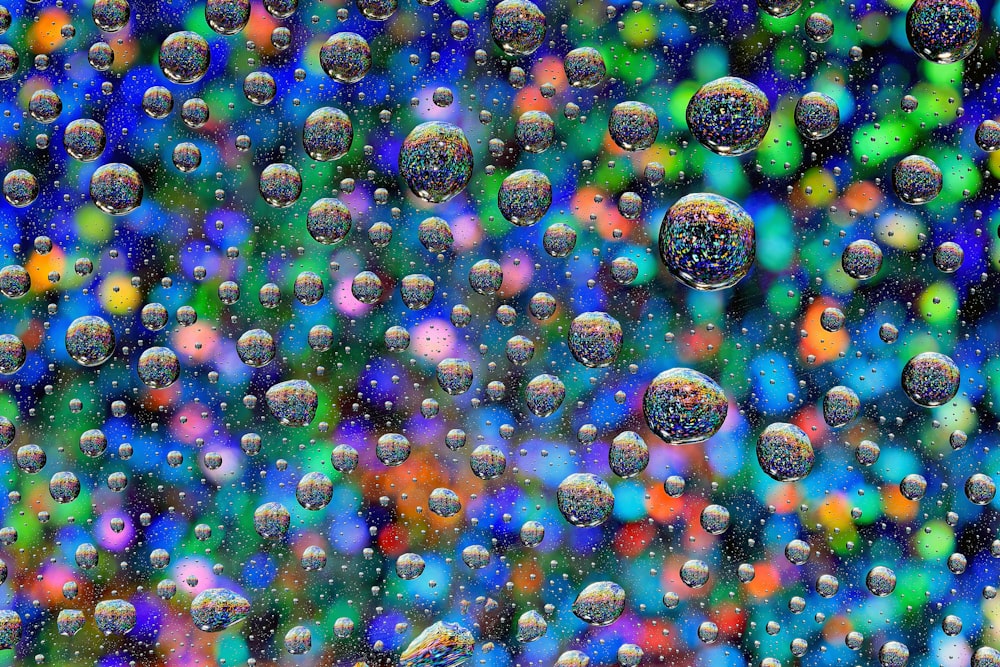 a bunch of bubbles that are on a window