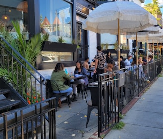 Outdoor seating area at Domuss with customers enjoying their meals in a relaxed atmosphere