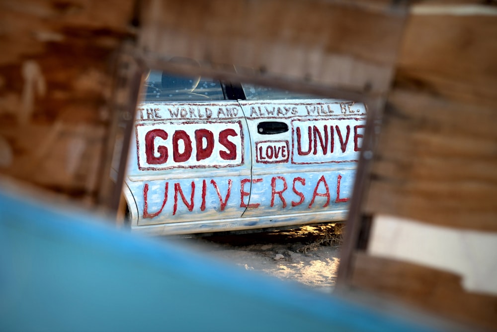a van with the words god's university painted on it