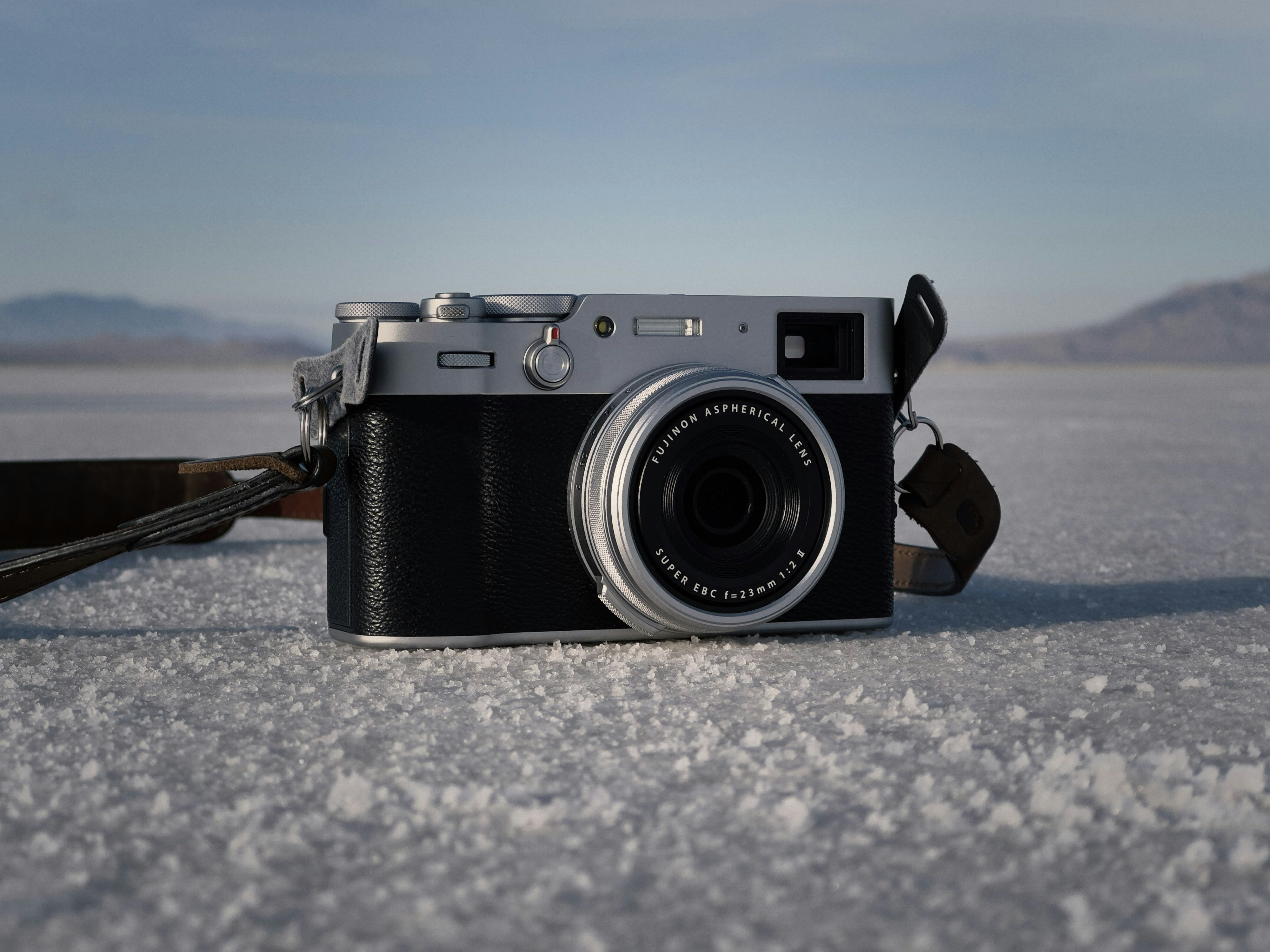 a camera sitting on top of a snow covered ground