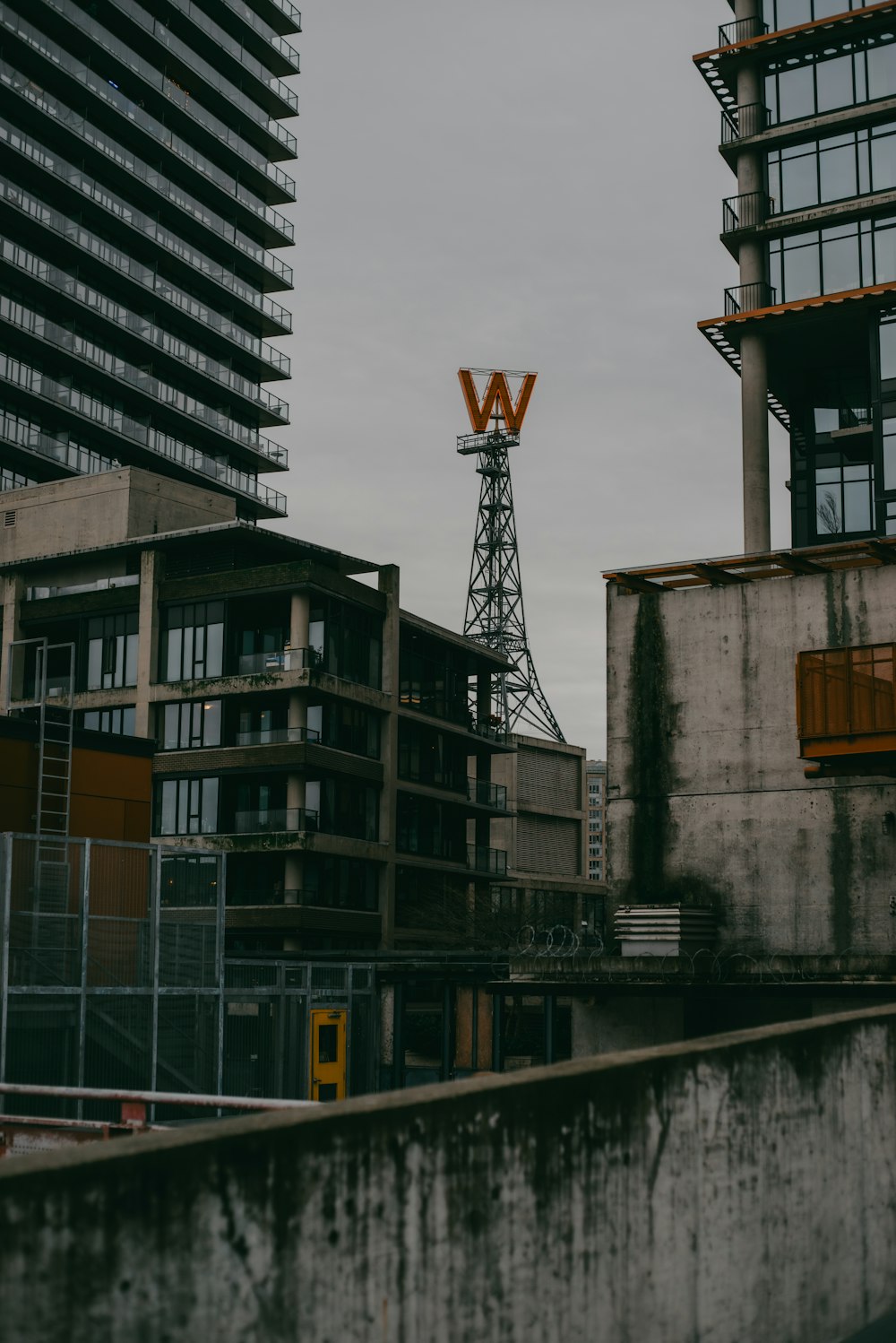 a tall building with a sign on top of it