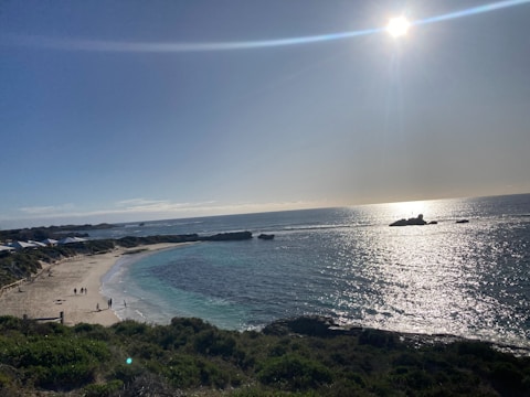 Cover art of the new single featuring a sunlit beach scene with the band’s name in bold.