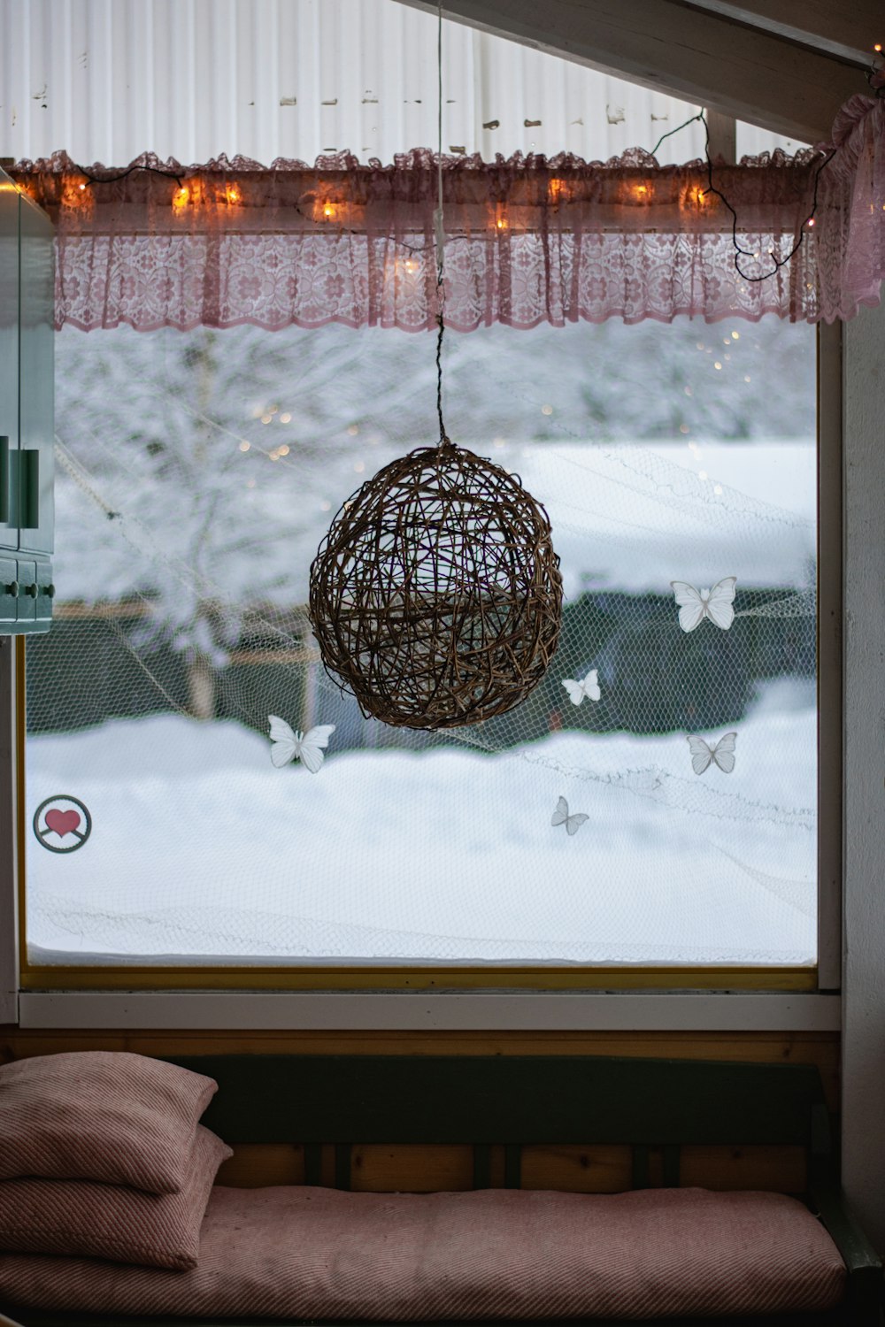 a window sill with a light hanging from it