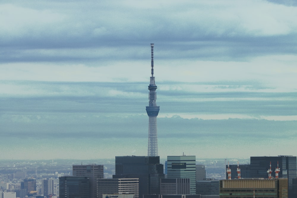 a view of a city with a very tall tower