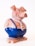 A vibrant 3D cartoon-style pig character from Pigs Revenge, mid-action with a playful expression.