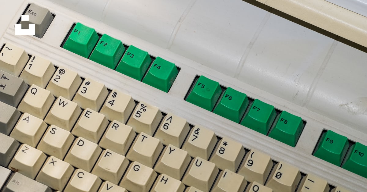 A close up of a computer keyboard with green keys photo – Free Computer ...