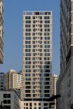 a tall building in the middle of a city