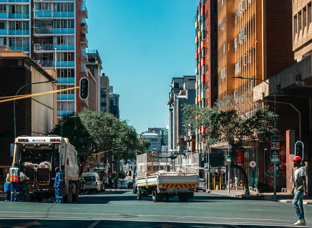 a city street filled with traffic and tall buildings