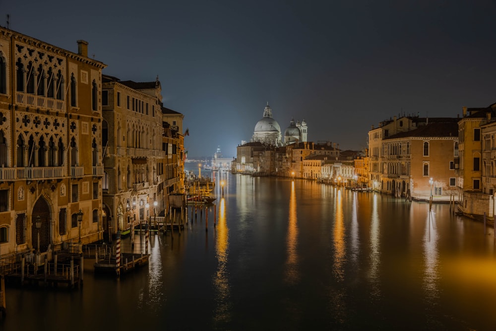 a night view of a city with a river running through it