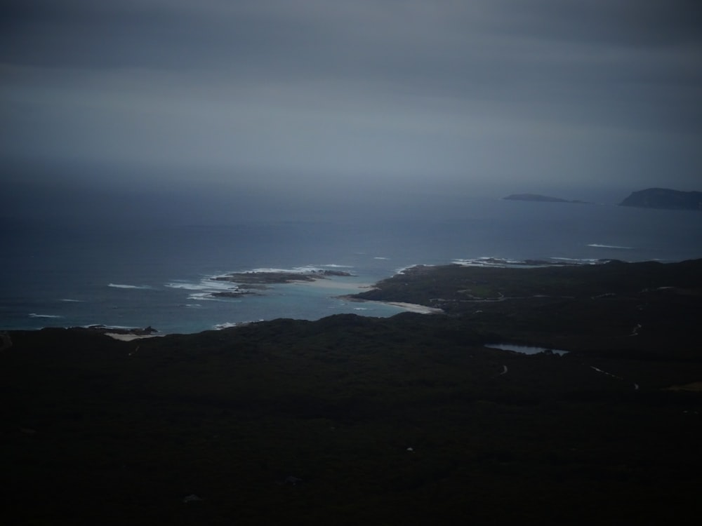 a view of a body of water from a hill