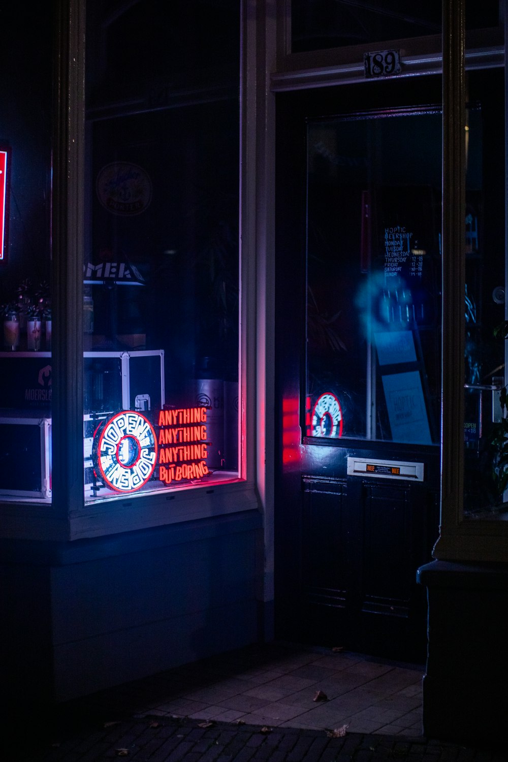 a neon sign in the window of a store