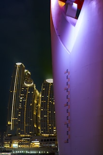 A panoramic shot of CyberHub’s modern architecture illuminated at night.