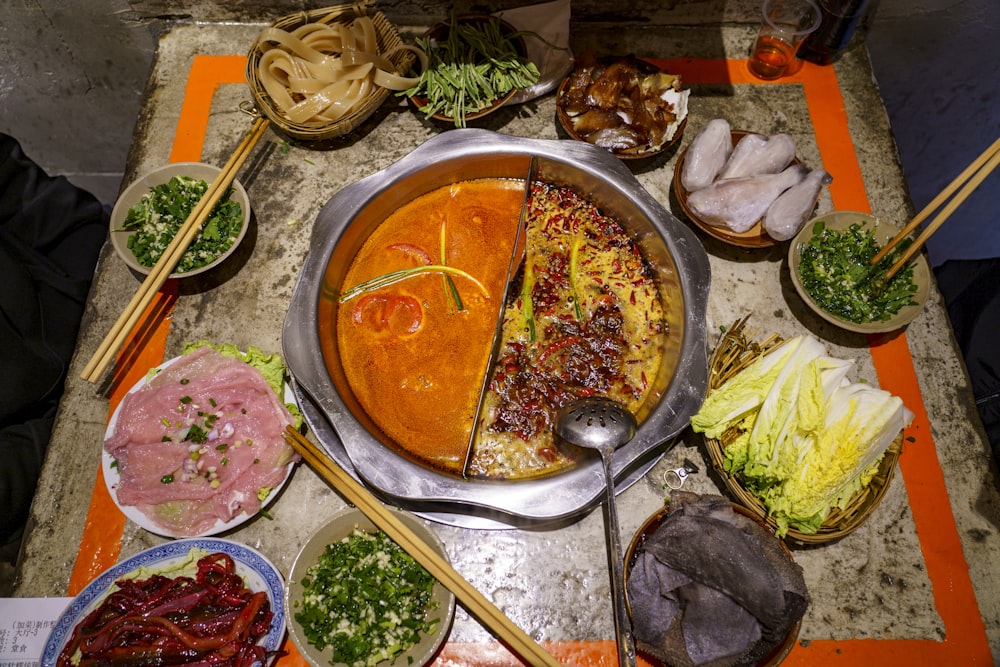 a table topped with lots of different types of food