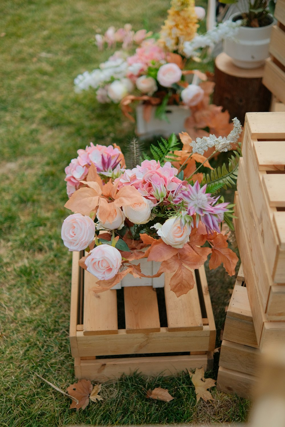 a couple of wooden boxes filled with flowers