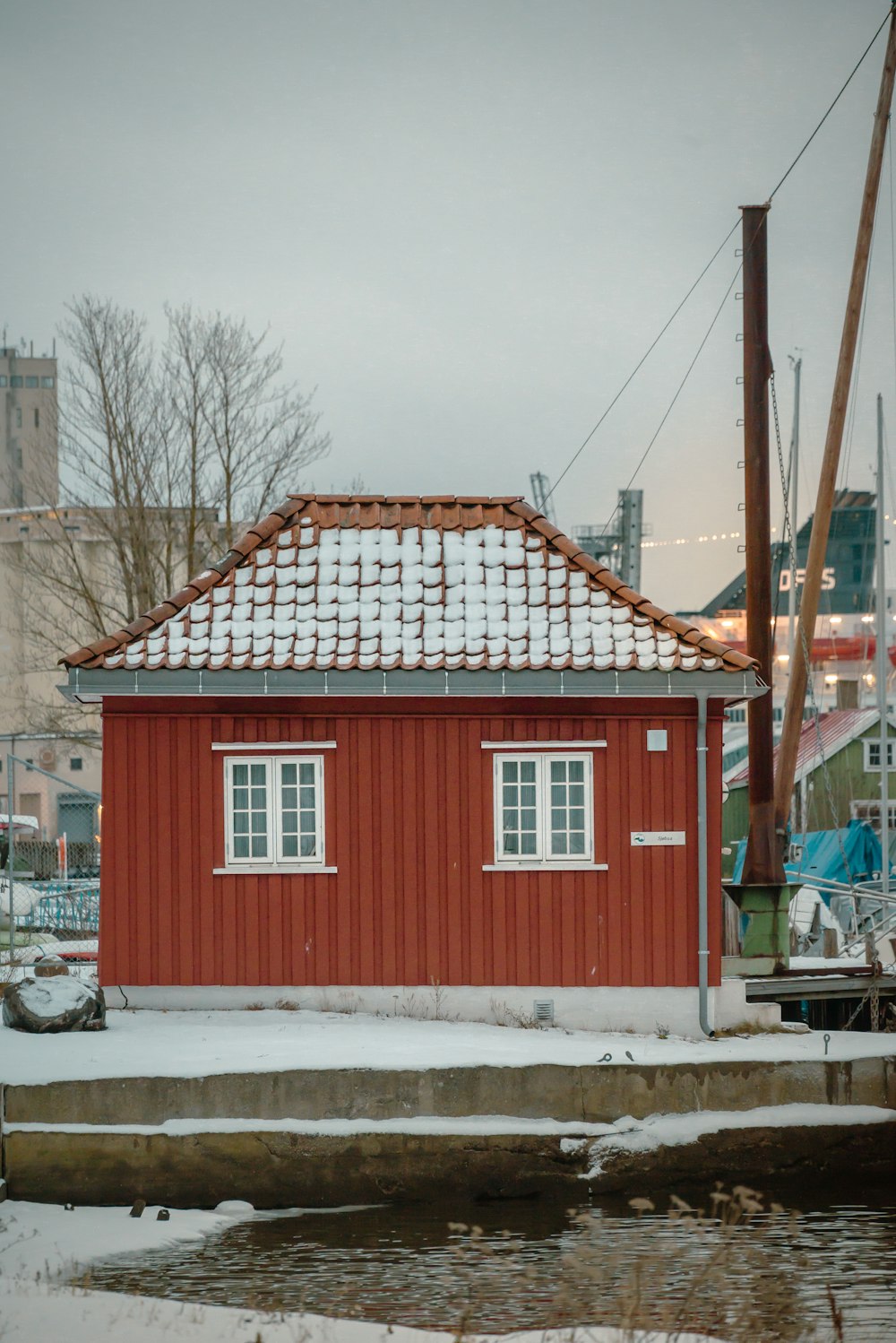 a small red building with a red roof