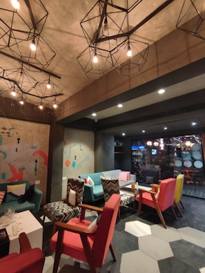 Modern interior with colorful cushions matching the logo's color scheme.