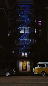 Nighttime shot of Climavita’s service van parked outside a well-lit commercial building