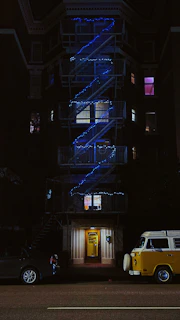 Nighttime shot of Climavita’s service van parked outside a well-lit commercial building