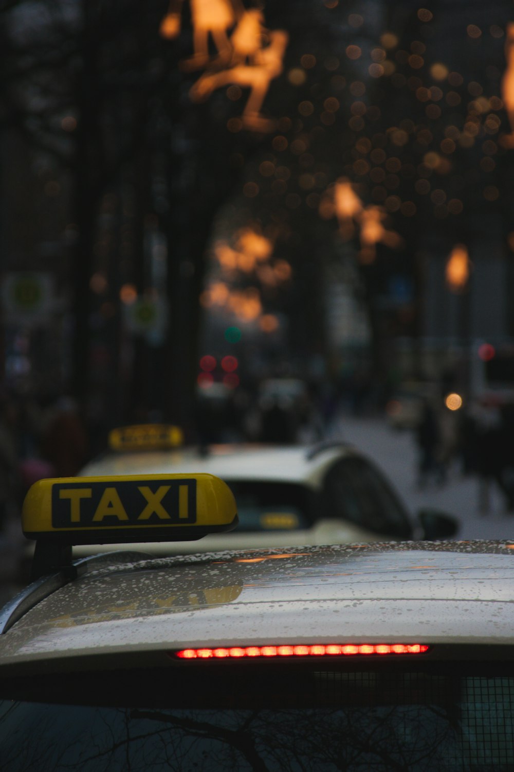 a taxi cab with a taxi light on top of it