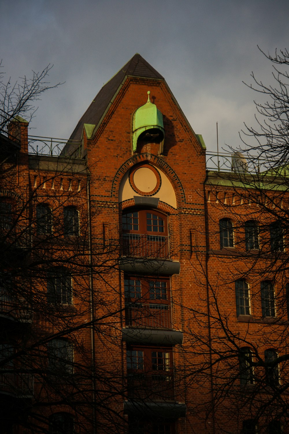 a large brick building with a clock on it's face