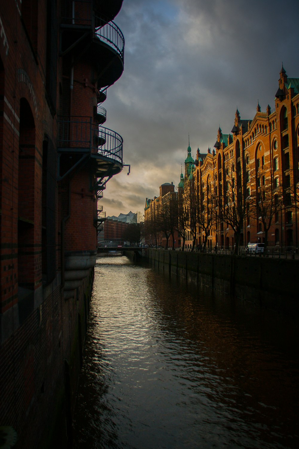 a river running through a city next to tall buildings