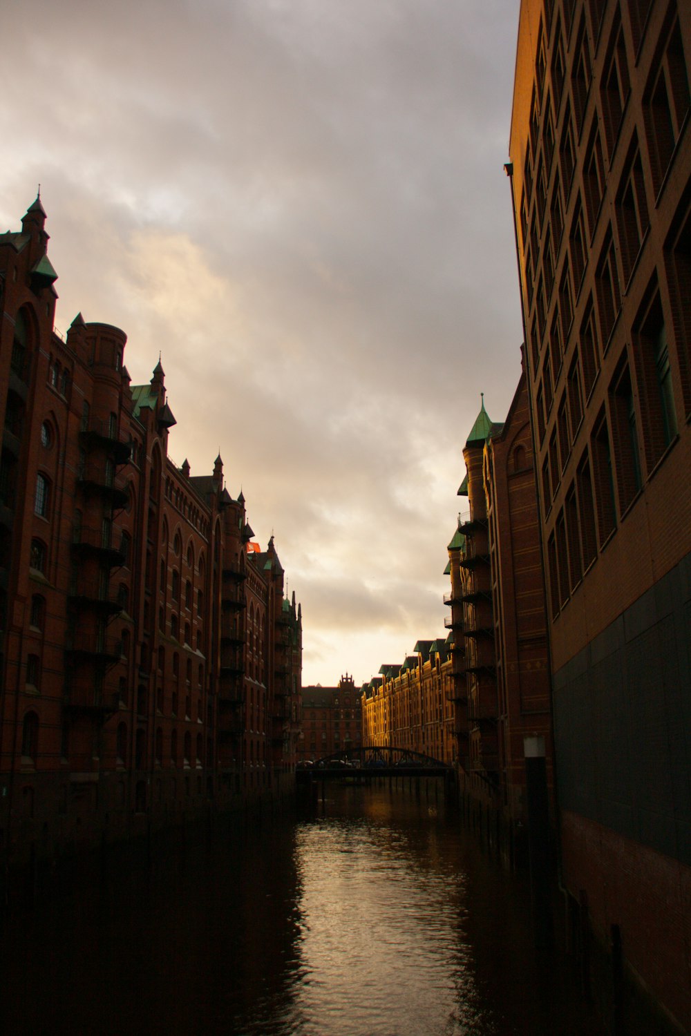 a river running through a city next to tall buildings