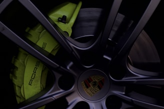 Close-up of a vibrant red PKL centre cap perfectly fitted on a sleek VW wheel.