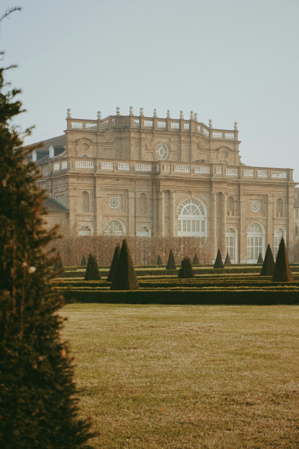 a large building with a large lawn in front of it