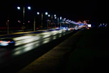 Night view of a well-lit highway with freshly painted lane markings